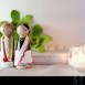 wooden cake toppers of an indian bride and groom