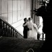 bride and groom kissing on the stairs