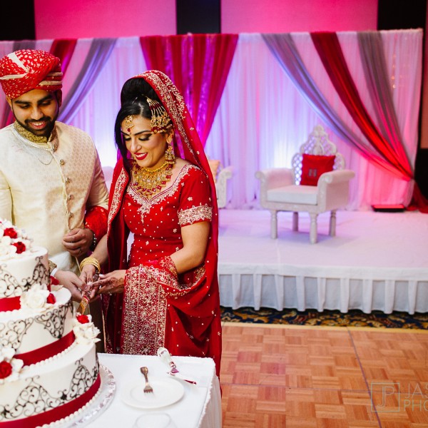 bride and groom cutting the cake