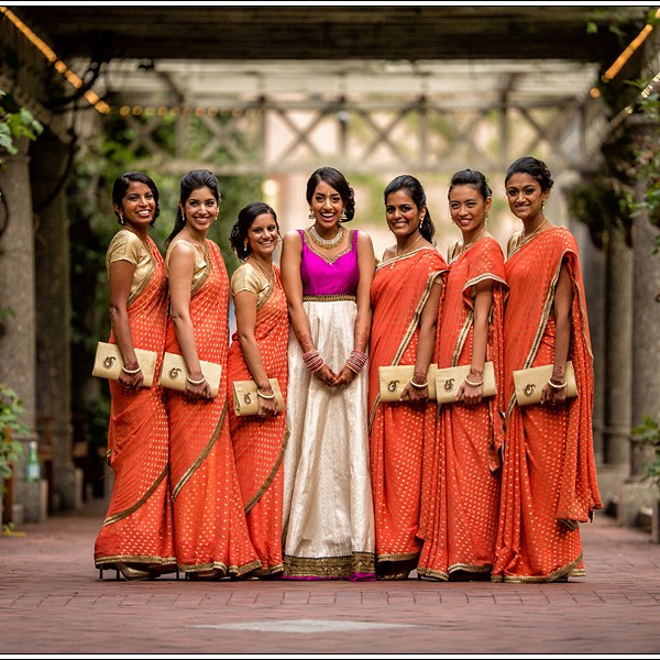 Indian bridesmaids in orange bridesmaids sarees