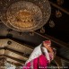 bride and groom in a hollywood kiss with a chandelier in the background