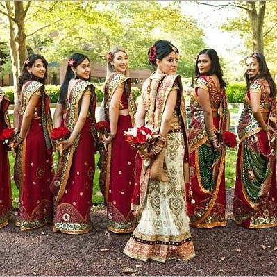 Indian bridesmaids in green and red sarees