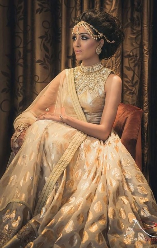 indian bride in a white and cream indian wedding dress