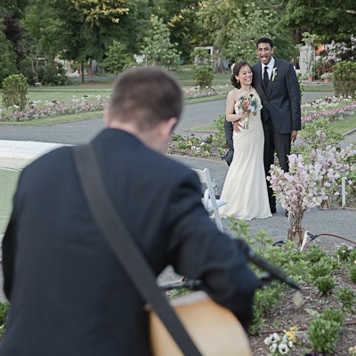 bride and groom with singer